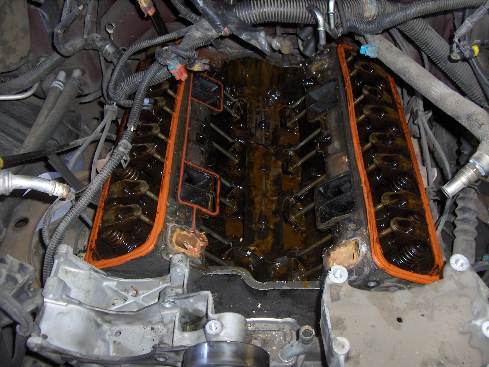 Engine with both valve covers and the intake off, rocker arms and pushrods exposed
